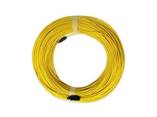 Coiled yellow Ethernet patch cable secured with ties on a white background