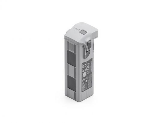 Rechargeable lithium‑ion camera battery with a top connector and release latch on the side in gray casing.