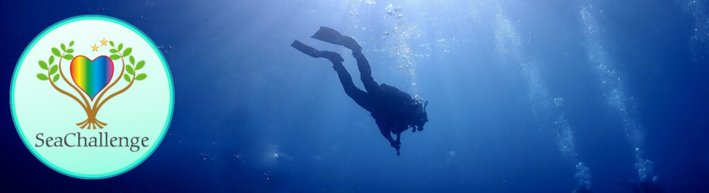 Underwater scene with a scuba diver swimming to the right of a circular SeaChallenge logo featuring a rainbow heart between green leaves.